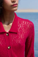 Pink raspberry-colored collared cardigan by La Granni, featuring a cozy knit with button front and ribbed cuffs.