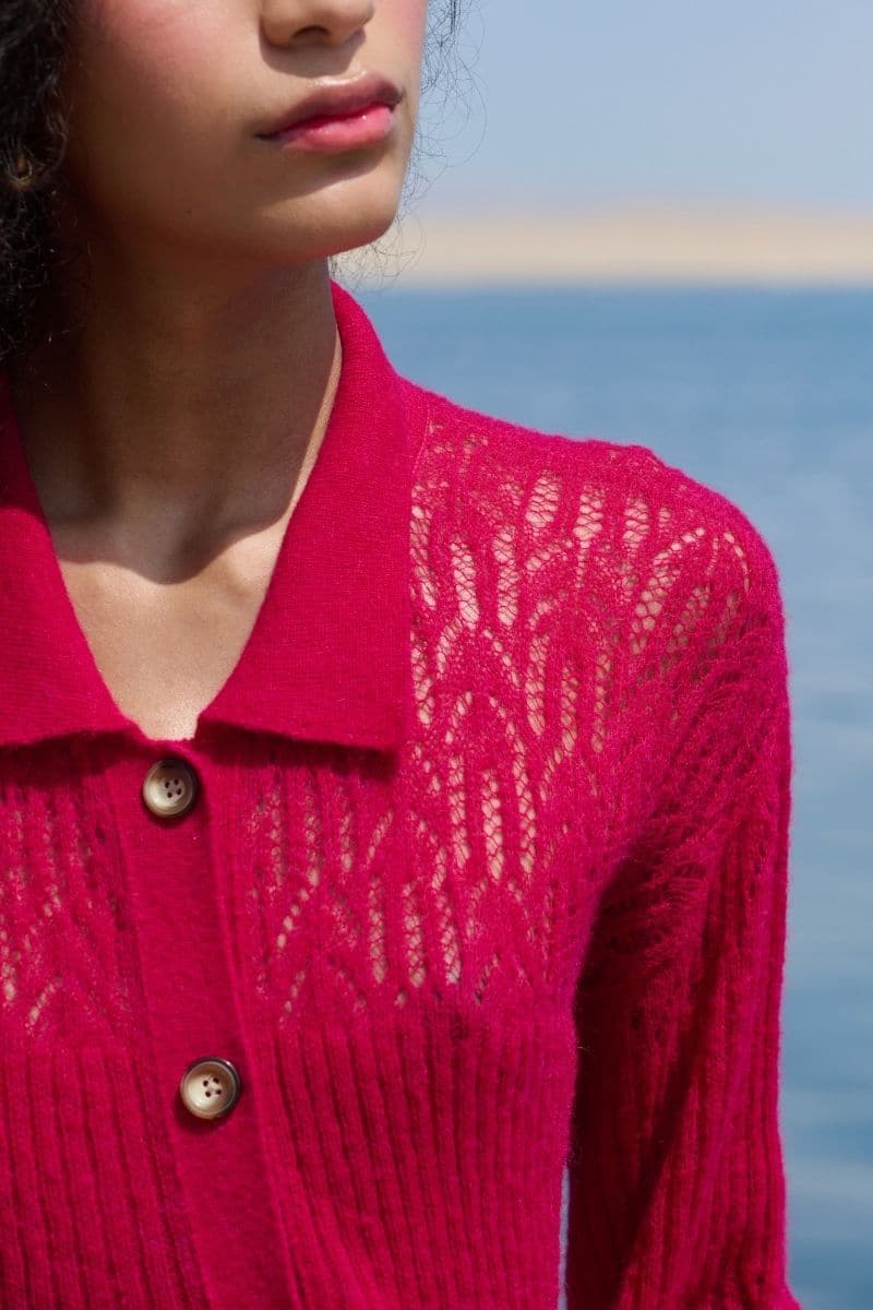 Pink raspberry-colored collared cardigan by La Granni, featuring a cozy knit with button front and ribbed cuffs.
