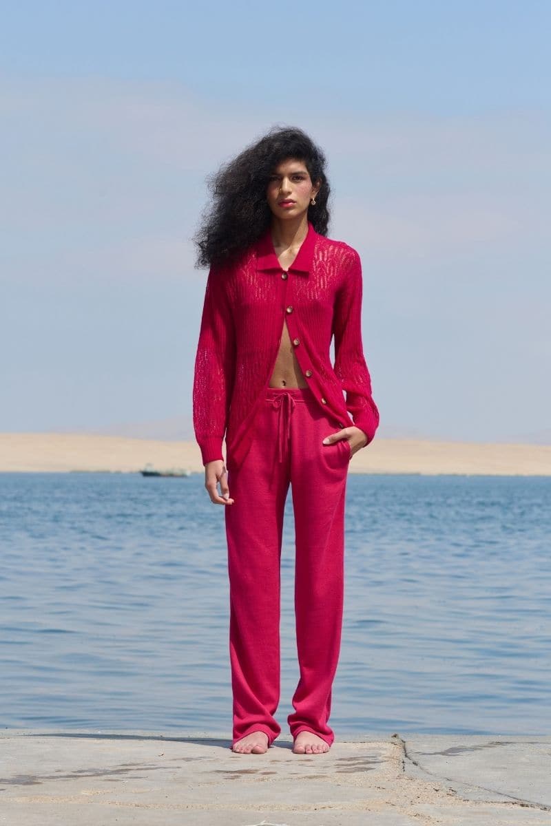 Pink raspberry-colored La Granni collared cardigan with a cozy knit texture, featuring a button-up front and ribbed cuffs.