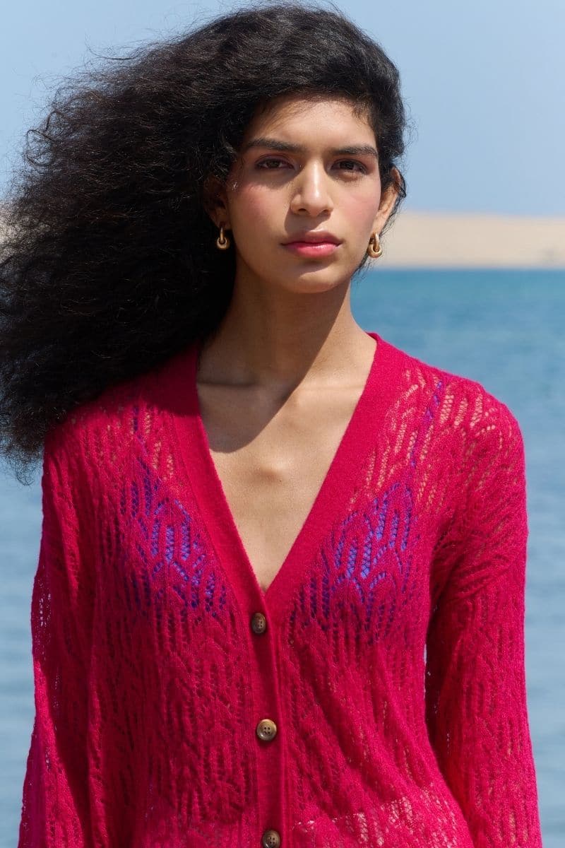 Pink raspberry-colored V-neck cardigan by La Granni, featuring a cute arañita pattern, perfect for a cozy, stylish look.