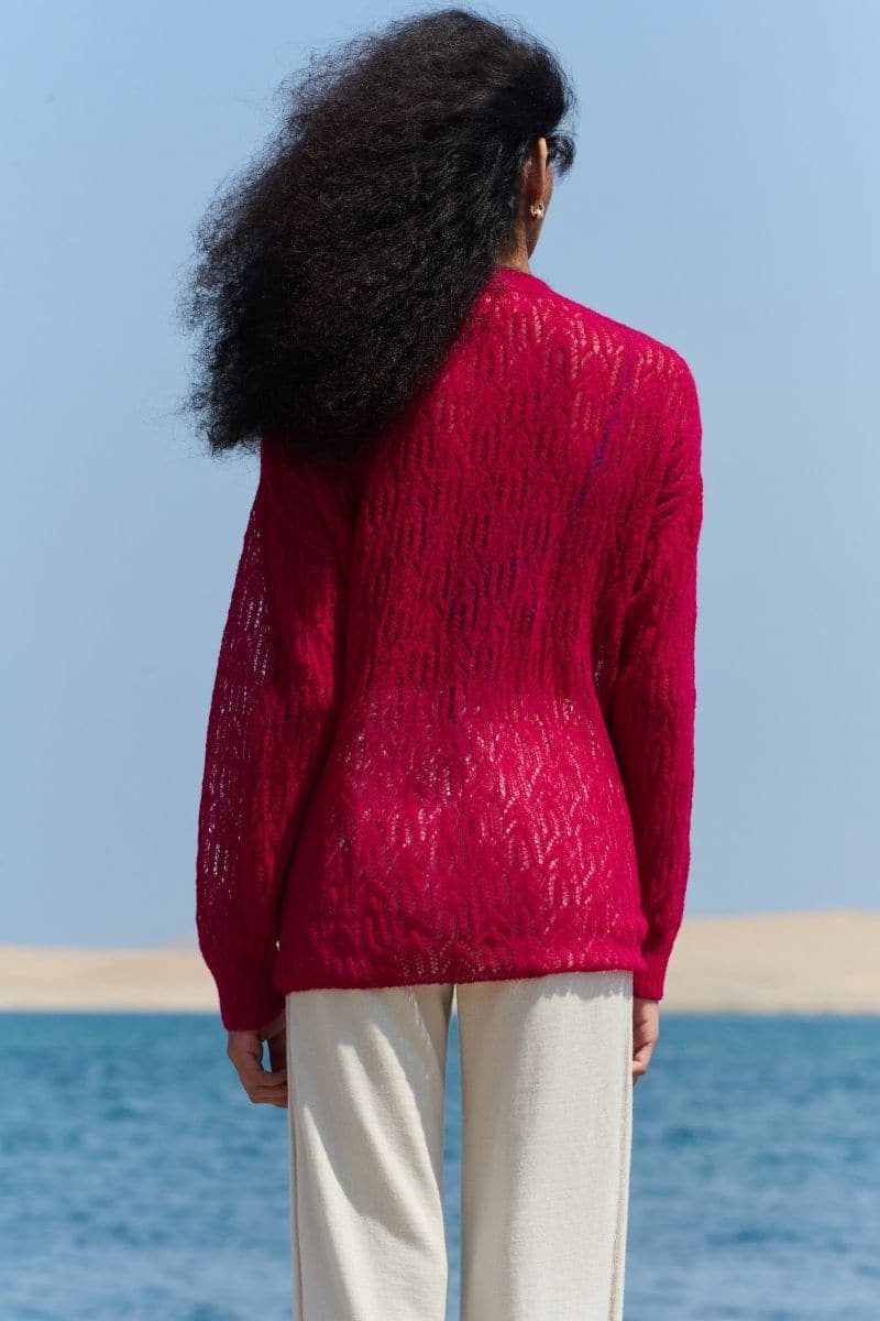 Pink raspberry V-neck cardigan by La Granni featuring a cute arañita design, perfect for casual and cozy outfits.