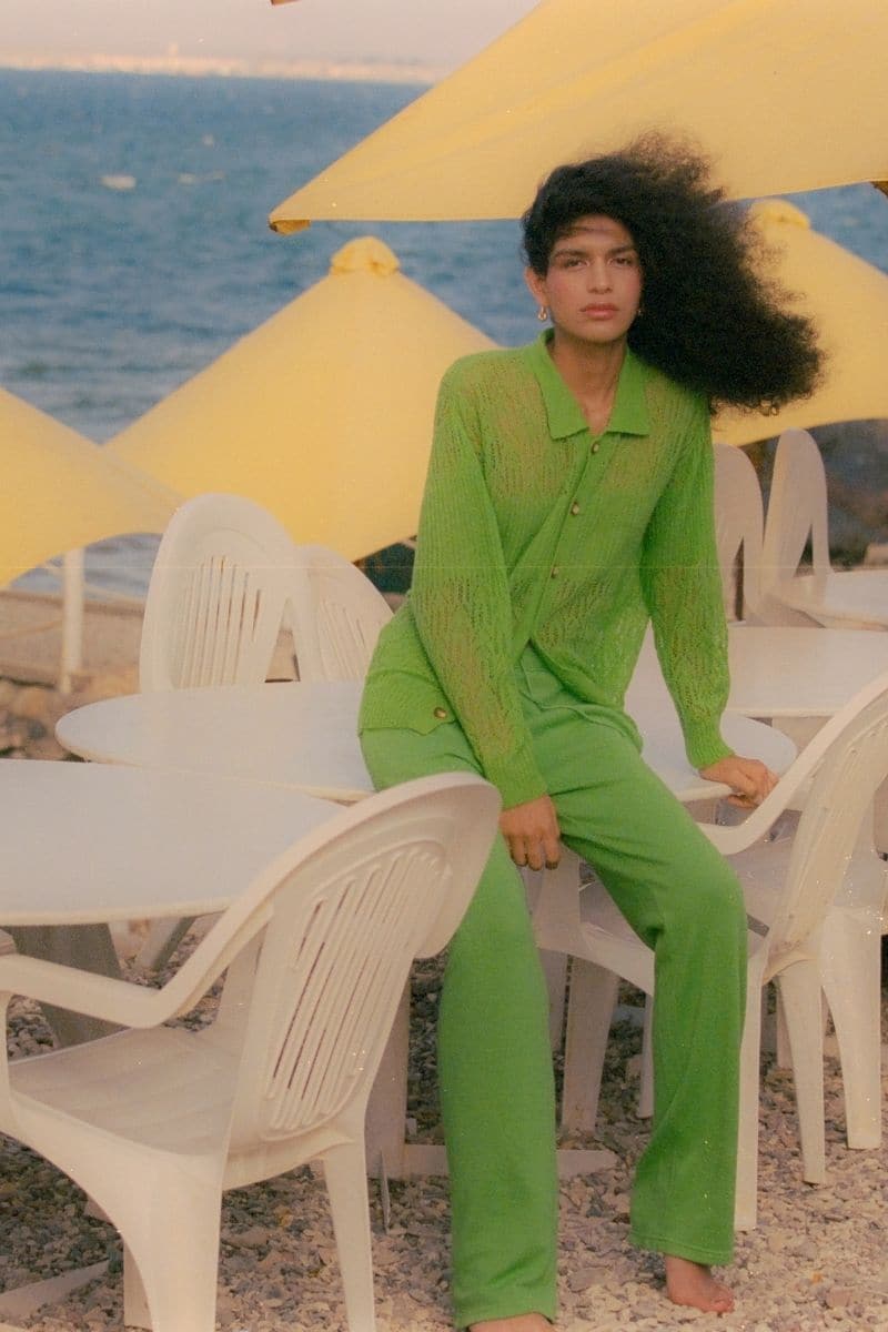 Green La Granni Arañita collared cardigan with long sleeves and button front, shown on a model.