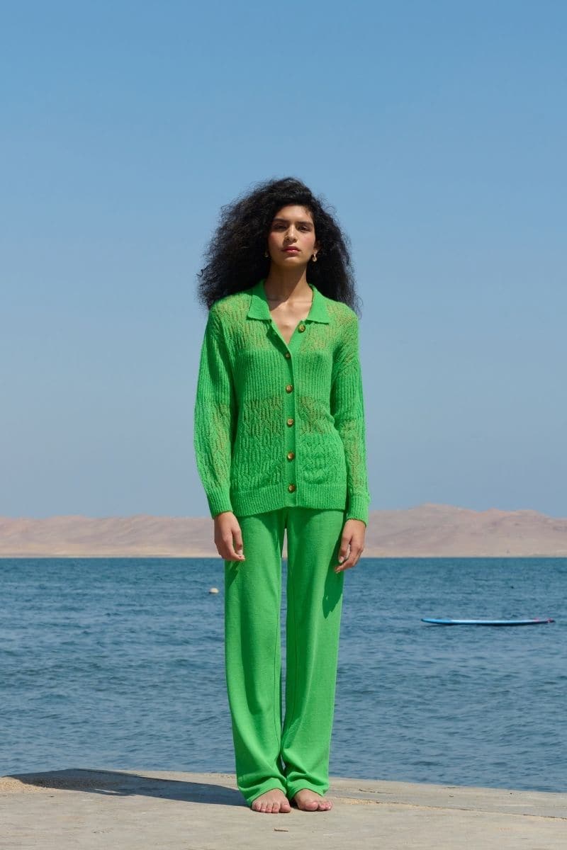 Green La Granni Arañita collared cardigan with long sleeves and button front, shown on a model.