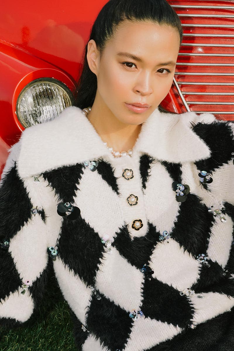 Lalo checkers collared sweater in black and white, featuring a cozy knit design and a classic collar style.