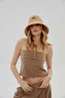Beige natural bucket hat by LE SH KA, showcasing a casual wide-brim design perfect for sun protection and stylish outdoor wear.
