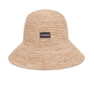 Beige natural bucket hat by LE SH KA, featuring a wide brim and casual style perfect for sun protection and outdoor wear.