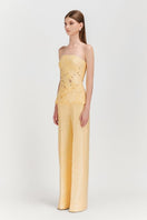 Pastel yellow strapless puffed top and matching pants co-ord set by Le Thanh Hoa, stylish and trendy, shown on a model.