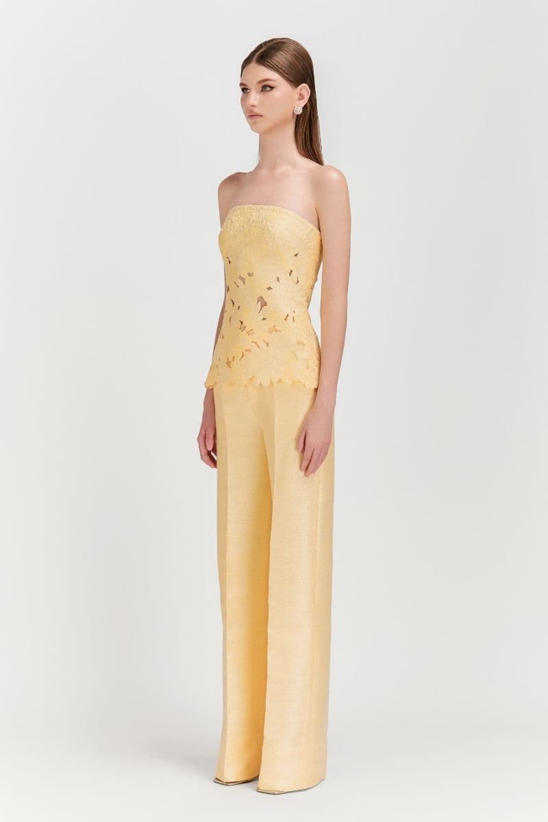 Pastel yellow strapless puffed top and matching pants co-ord set by Le Thanh Hoa, stylish and trendy, shown on a model.