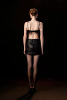Black EVA crop top and mini skirt co-ord set by Le Thanh Hoa, stylish and fitted for a trendy look.