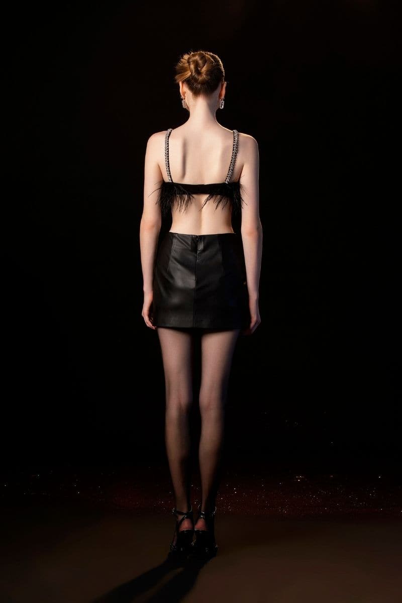 Black EVA crop top and mini skirt co-ord set by Le Thanh Hoa, stylish and fitted for a trendy look.