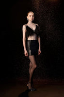 Black EVA crop top and mini skirt set by Le Thanh Hoa, stylish co-ords for a trendy look.
