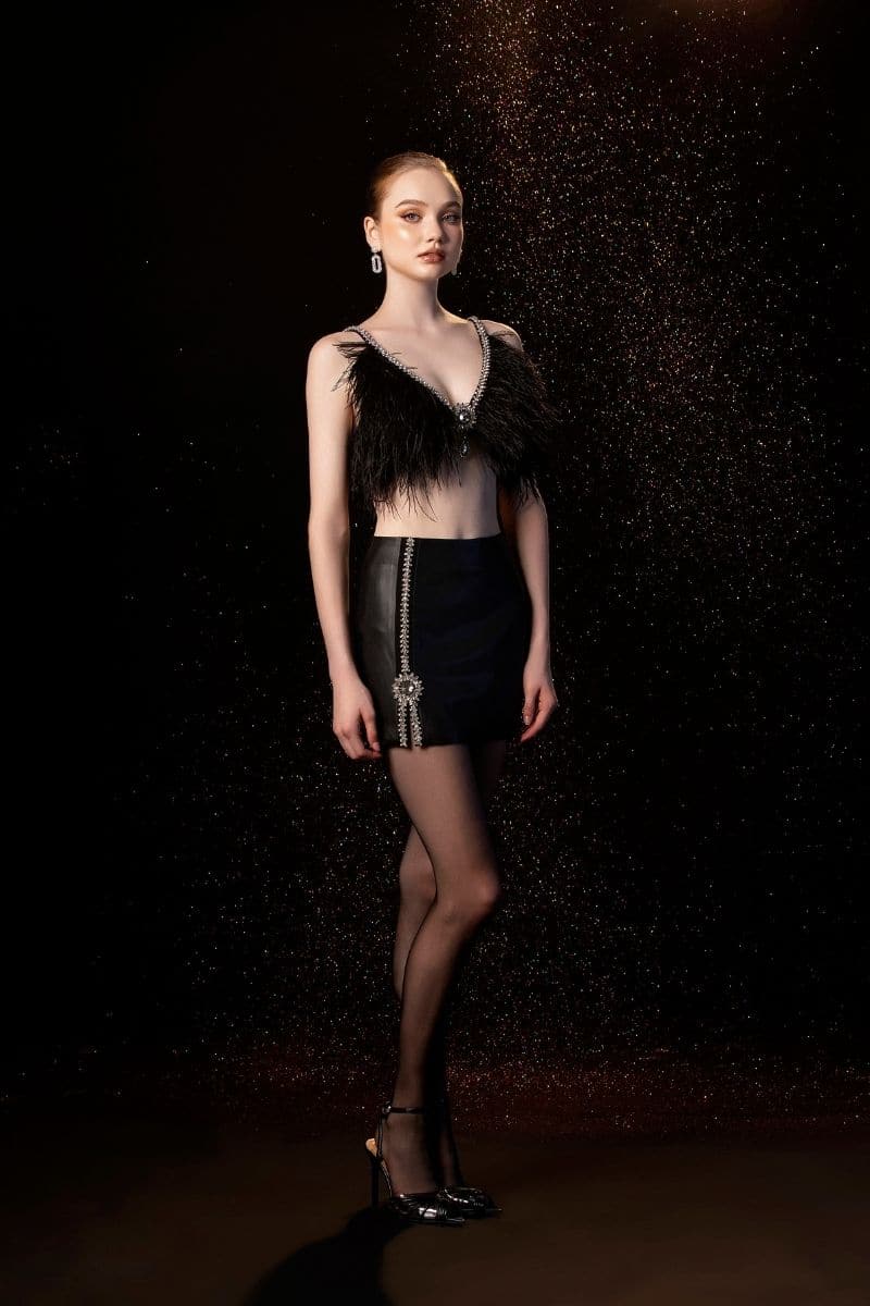 Black EVA crop top and mini skirt set by Le Thanh Hoa, stylish co-ords for a trendy look.
