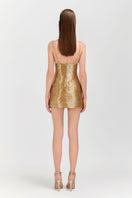 Le Thanh Hoa golden floral mini dress with short sleeves and fitted silhouette, stylish and perfect for summer occasions.
