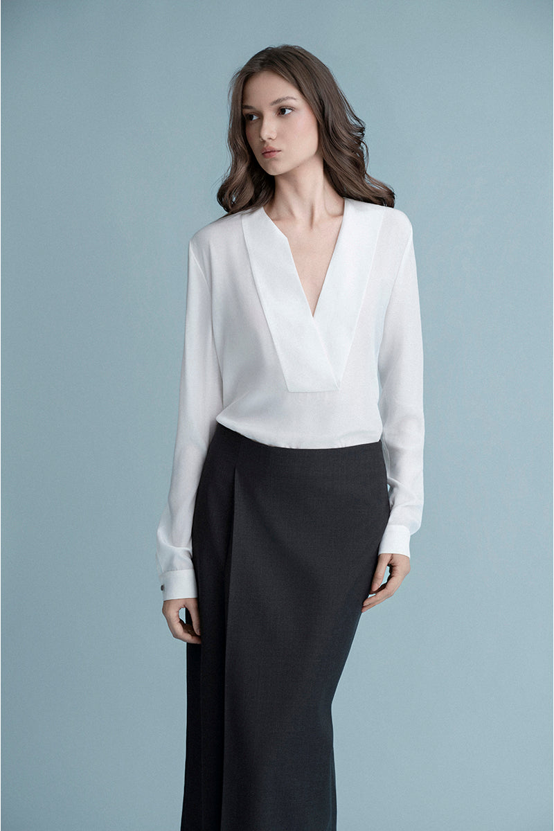 White Dalston shirt by LEKIEU, showcasing a classic button-up design with collar and long sleeves.