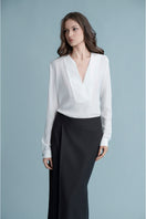 White Dalston shirt by LEKIEU, showcasing a classic button-up design with collar and long sleeves.