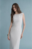 Off-white LEKIEU Muchen midi dress with a fitted silhouette and elegant design, showcased on a mannequin.
