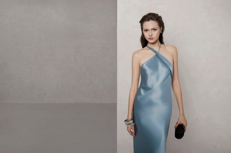 Blue KARLSRUHE maxi dress by LEKIEU, flowing fabric and elegant design, shown on a model.