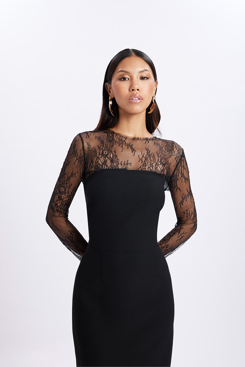 Black LENORA CREPE MAXI DRESS by Gigii's, flowing maxi dress with a sleek crepe fabric, displayed on a hanger.