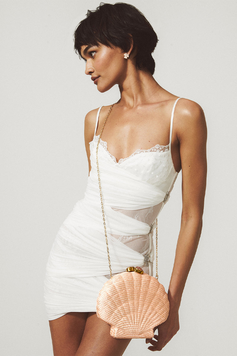 Emm Kuo Le Sirenuse woven shell clutch in pink with textured woven design and compact shape for elegant carrying.