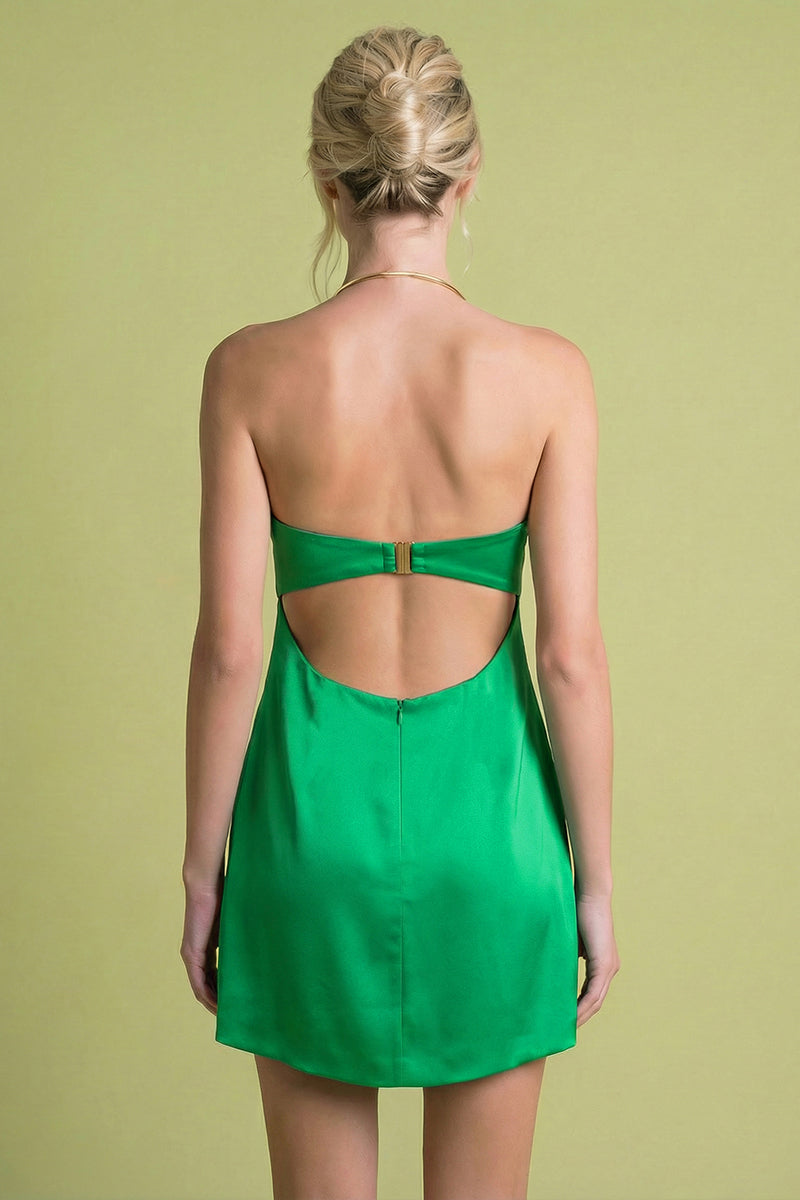 Back view of Laura Escobar Lily Mini Dress in emerald, showcasing its stylish fit and vibrant color.
