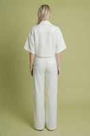 White Laura Escobar Lina Pants, tailored wide-leg trousers with a clean, minimalist design and high-waisted fit.