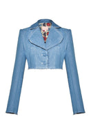 Liya Aqua Denim Cropped Blazer shown on model, featuring a fitted design with lapel collar and front buttons.
