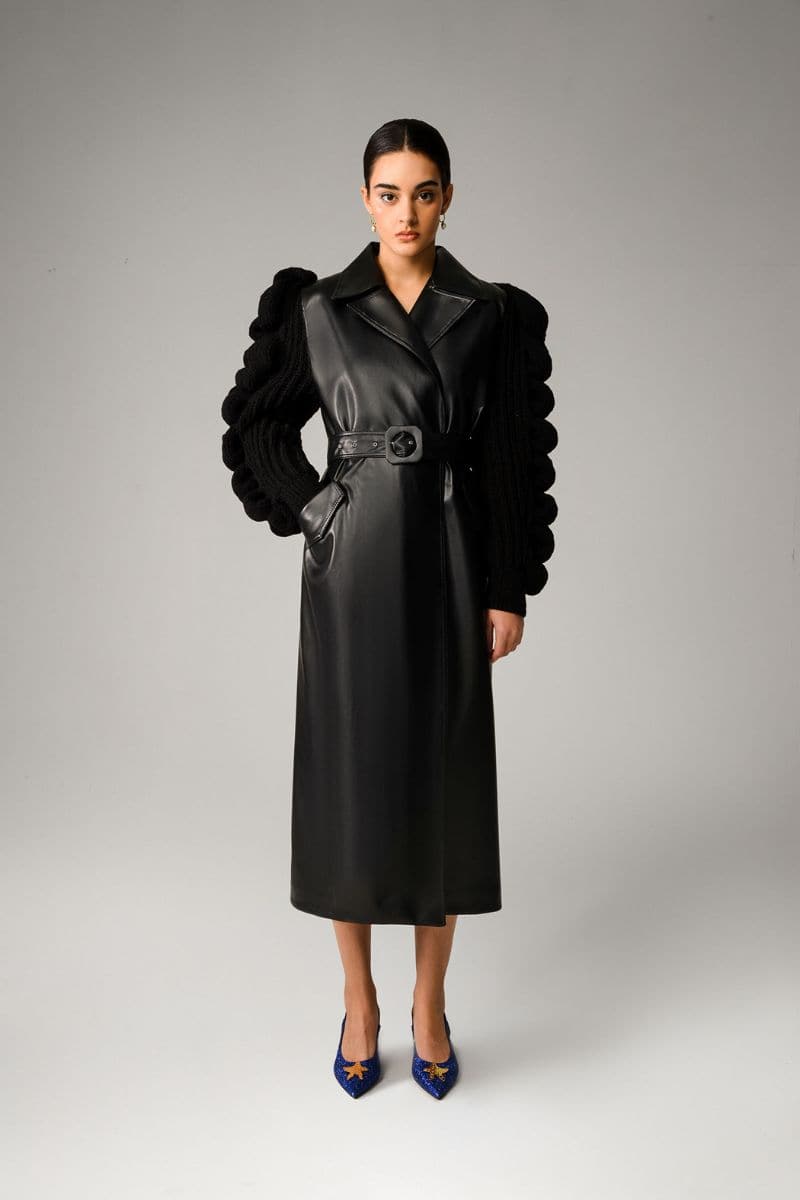Black Liya trench coat for women, stylish long coat with classic design, made by Liya, shown on a model.