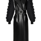 Black Liya trench coat for women, stylish and tailored with classic design, shown on a model in a fashion photo.
