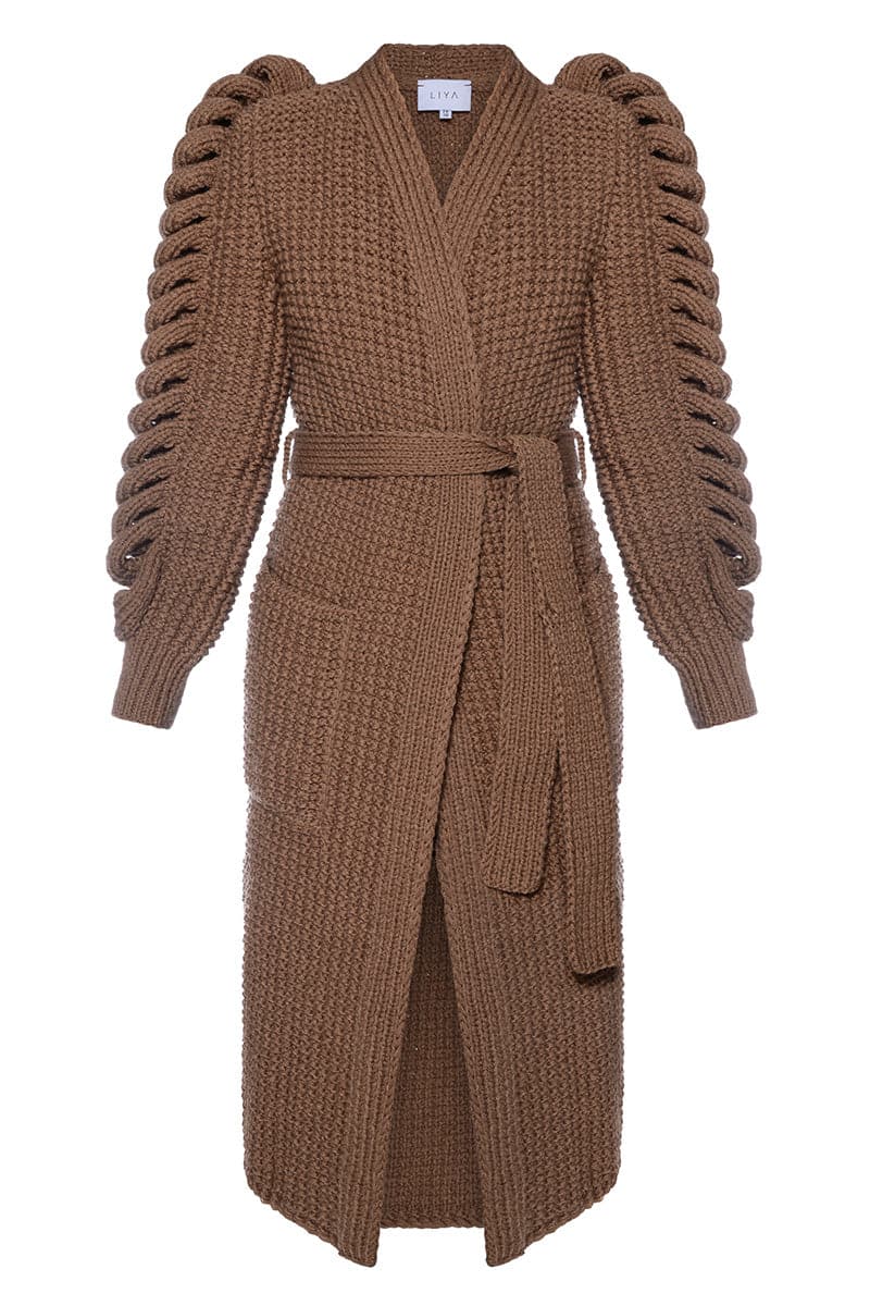 Dark brown Liya hand-knitted coat with long sleeves and textured knit pattern, stylish and cozy for cold weather.