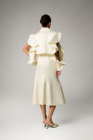 Liya ivory trench coat displayed on a hanger, featuring classic double-breasted design, belt, and tailored fit for women.