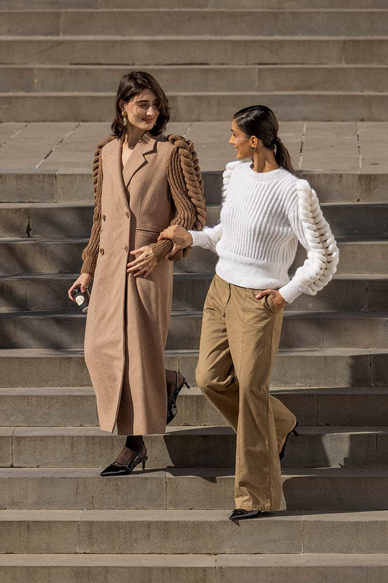 Liya white turtleneck sweater with a cozy fit, showcasing a classic snow-white knit design on a model.