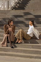 Liya white turtleneck sweater with a cozy fit, featuring a classic high neckline and soft knit fabric.