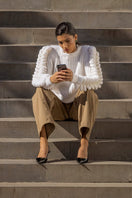 Liya white turtleneck sweater with a cozy fit, featuring a classic design and soft knit fabric, perfect for cold weather.