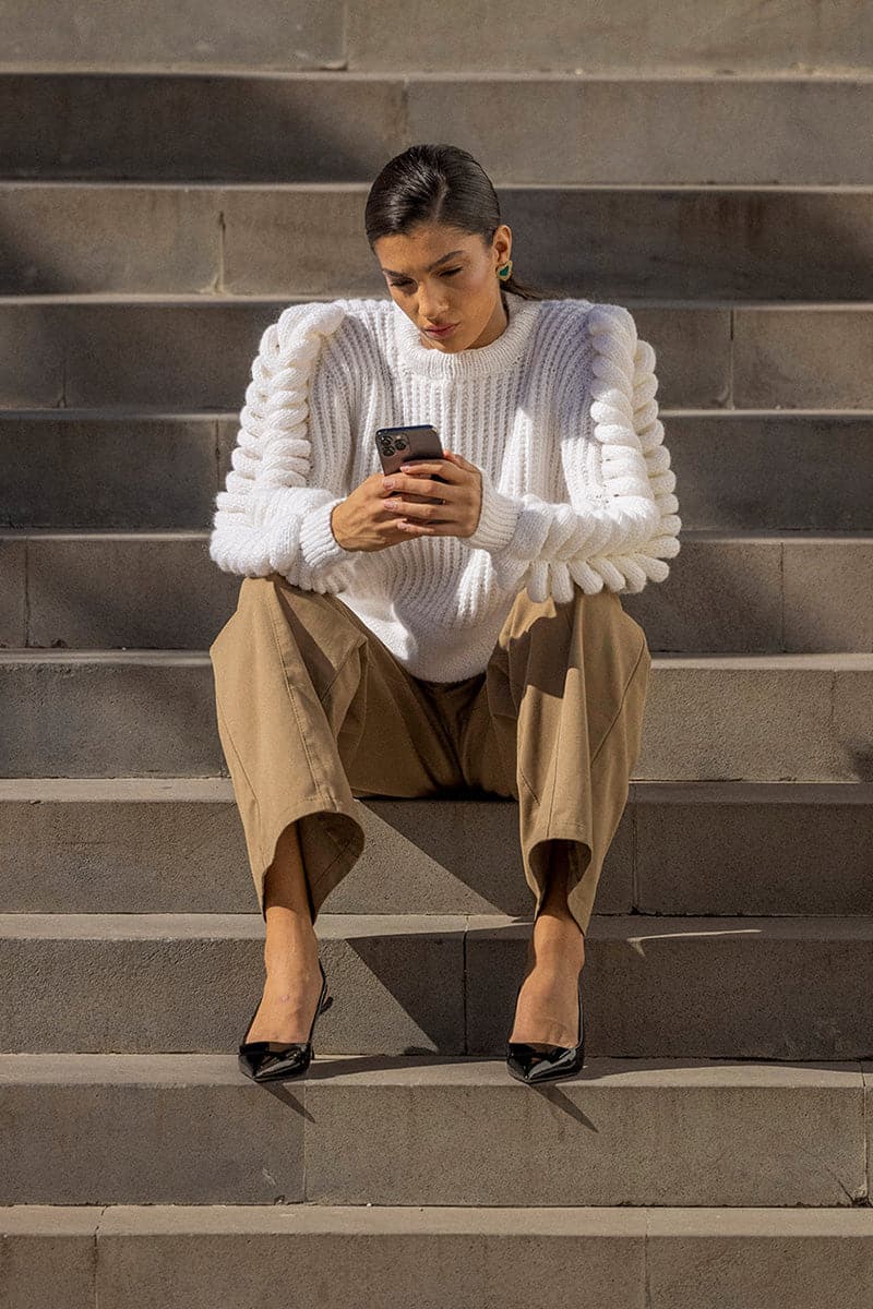 Liya white turtleneck sweater with a cozy fit, featuring a classic design and soft knit fabric, perfect for cold weather.