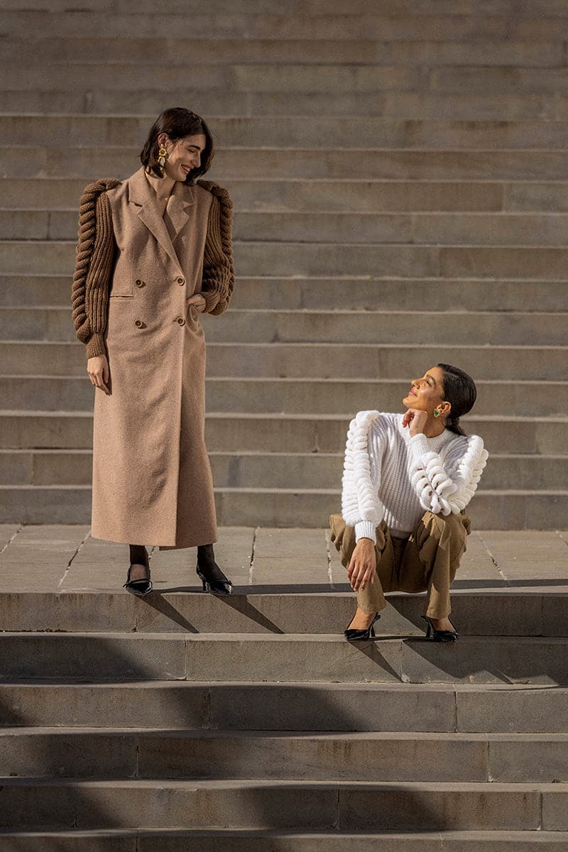 Liya white turtleneck sweater with long sleeves, cozy knit fabric, and a classic fit, perfect for layered winter style.