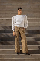 Liya white turtleneck sweater with a cozy fit, featuring a classic high neckline and soft knit fabric, perfect for winter wear.