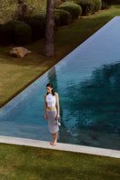 Blue IKINITA water skirt, midi length, flowing fabric with a stylish, modern design perfect for casual and summer wear.