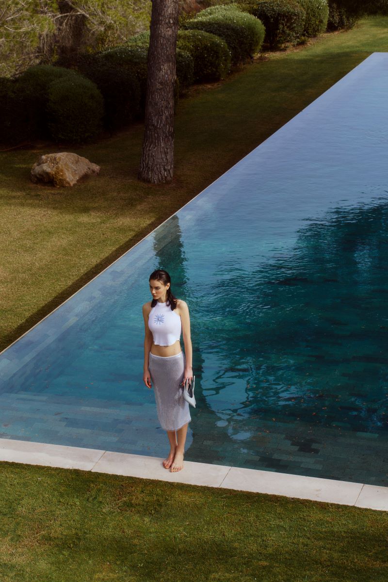 Blue IKINITA water skirt, midi length, flowing fabric with a stylish, modern design perfect for casual and summer wear.
