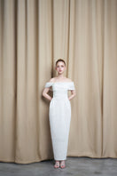 Ivory off-shoulder draped gown with sequins from HACCHIC COUTURE, featuring elegant design and flowing fabric.
