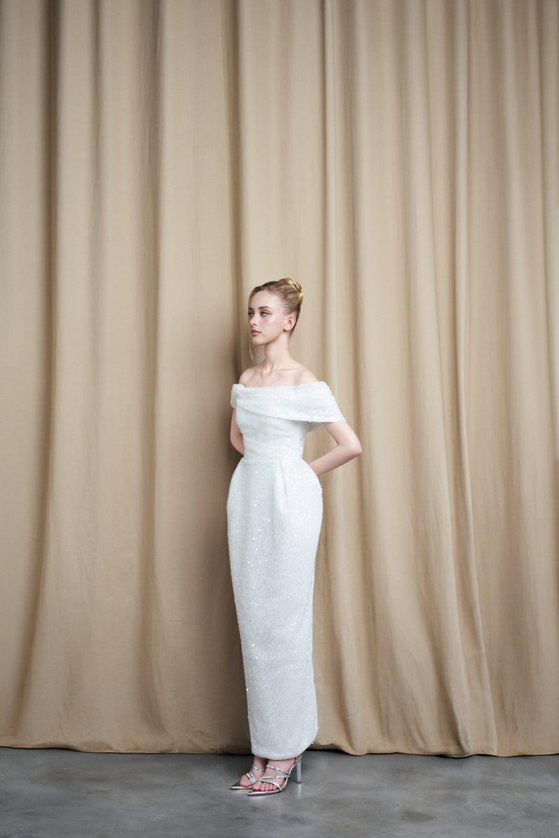 Ivory off-shoulder drape sequin gown by HACCHIC COUTURE, featuring elegant flowing fabric and intricate sequin details.