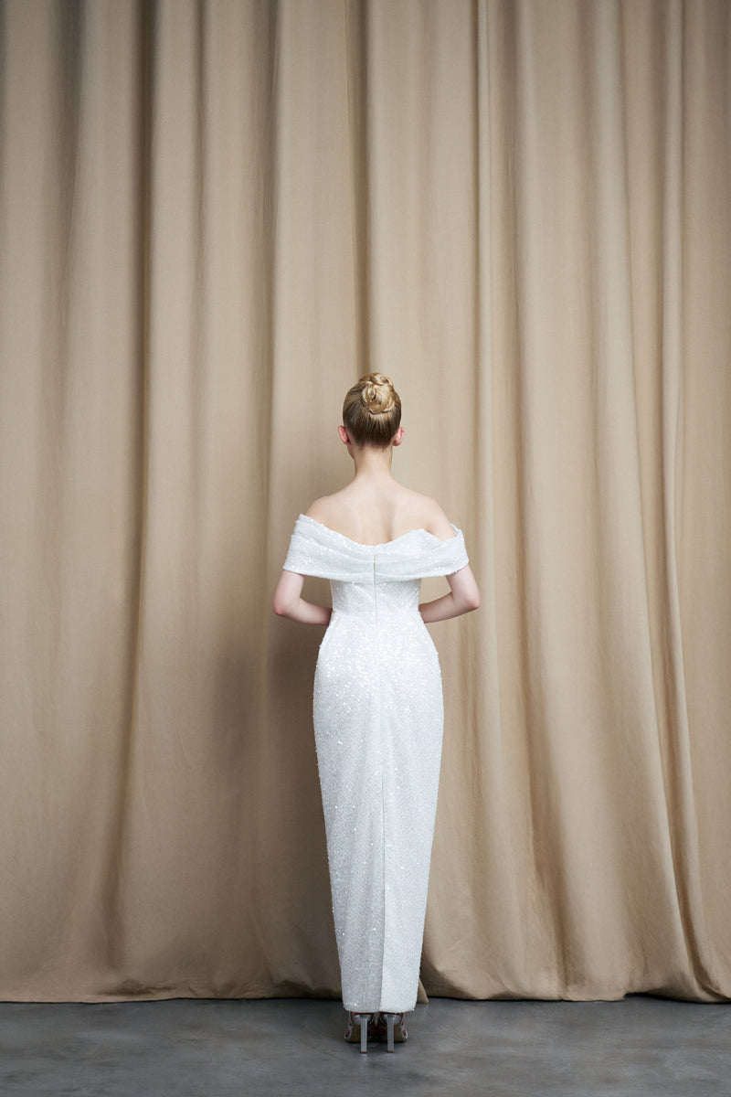 Elegant ivory off-shoulder drape gown with sequins from HACCHIC COUTURE, showcased in a sophisticated lookbook image.