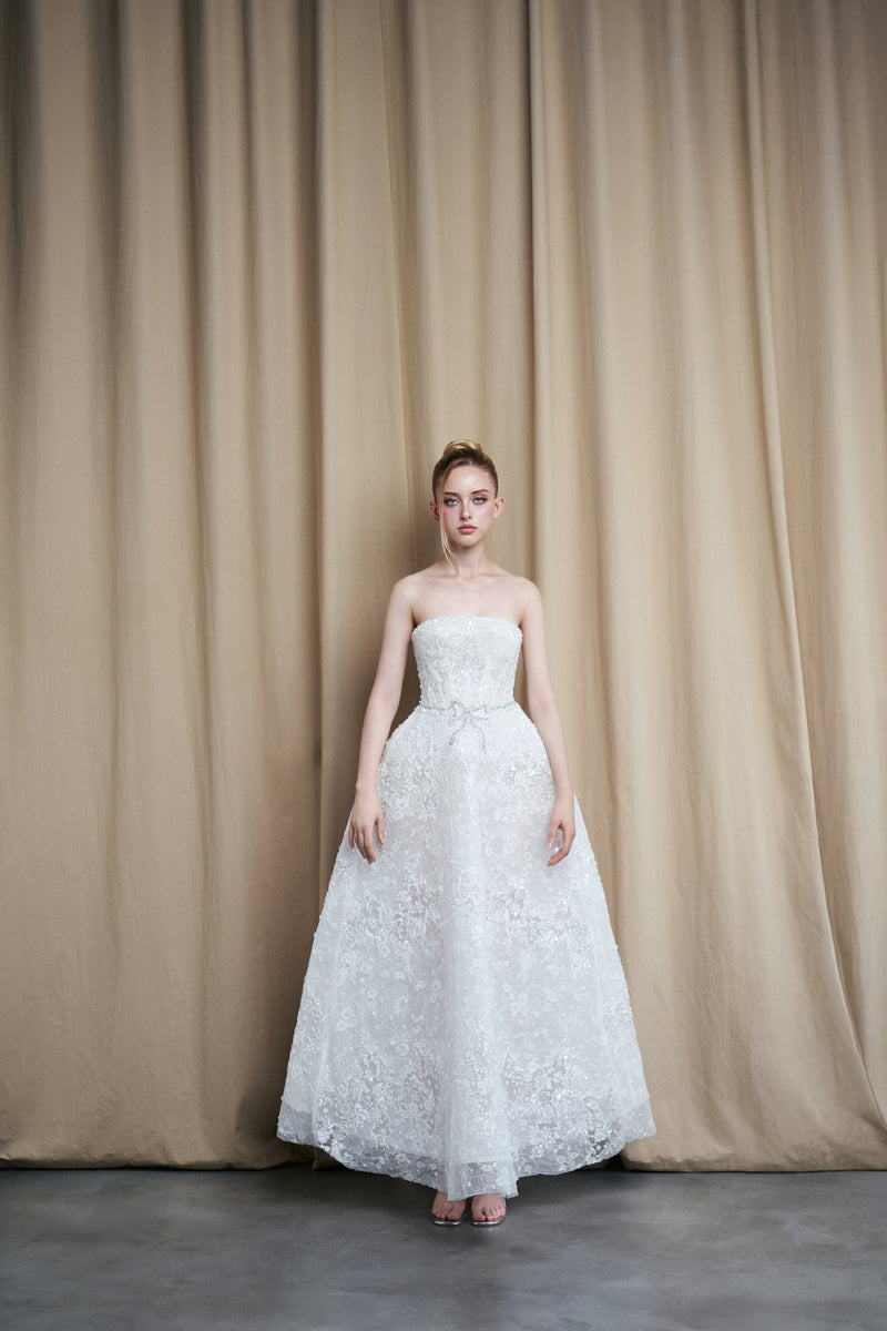 STRAPLESS FLORAL LACE A-LINE GOWN WITH BOW ACCENT