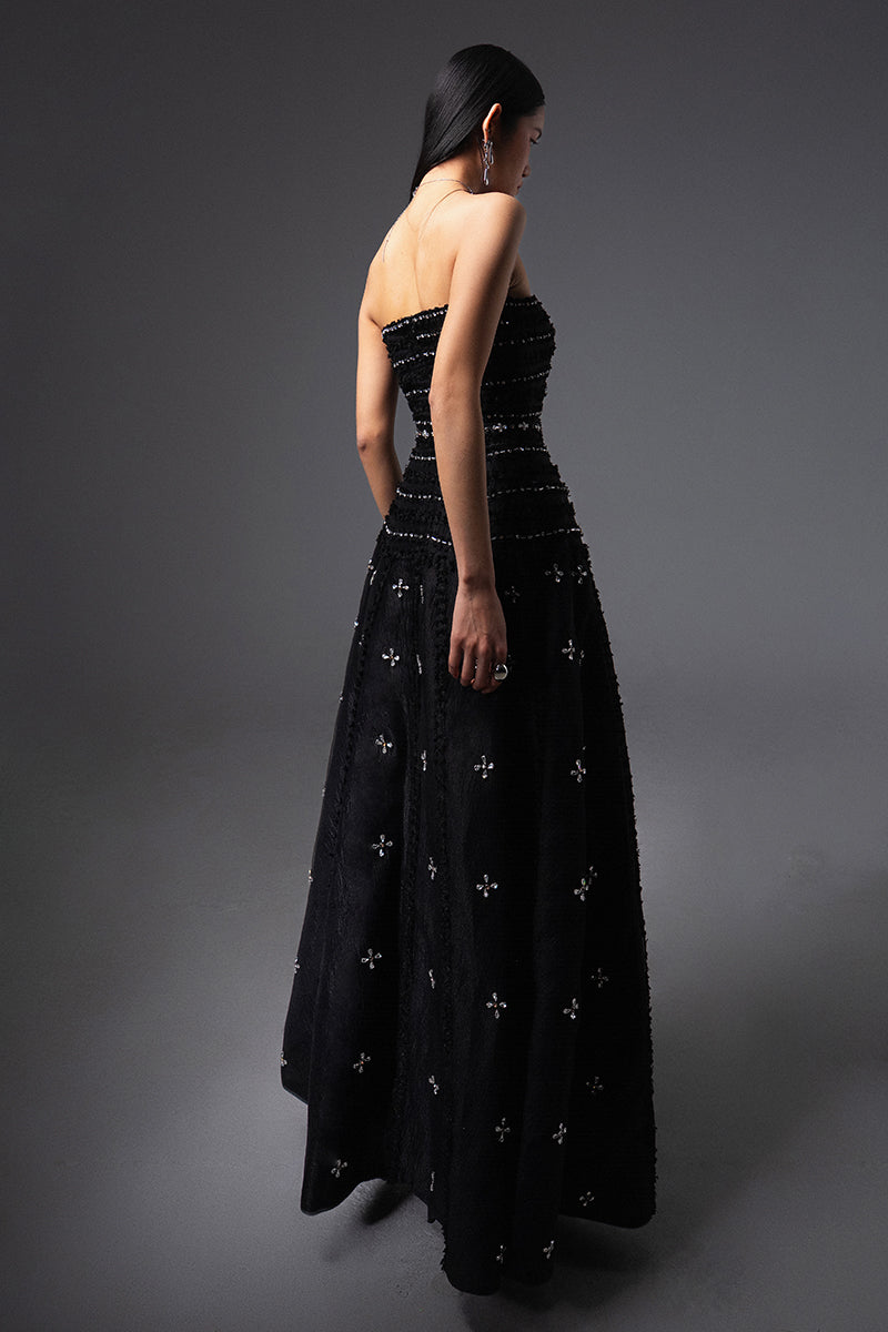 Black CULT MIA X HAPPY CLOTHING strapless gown in stone organza with a flowing silhouette and elegant design.