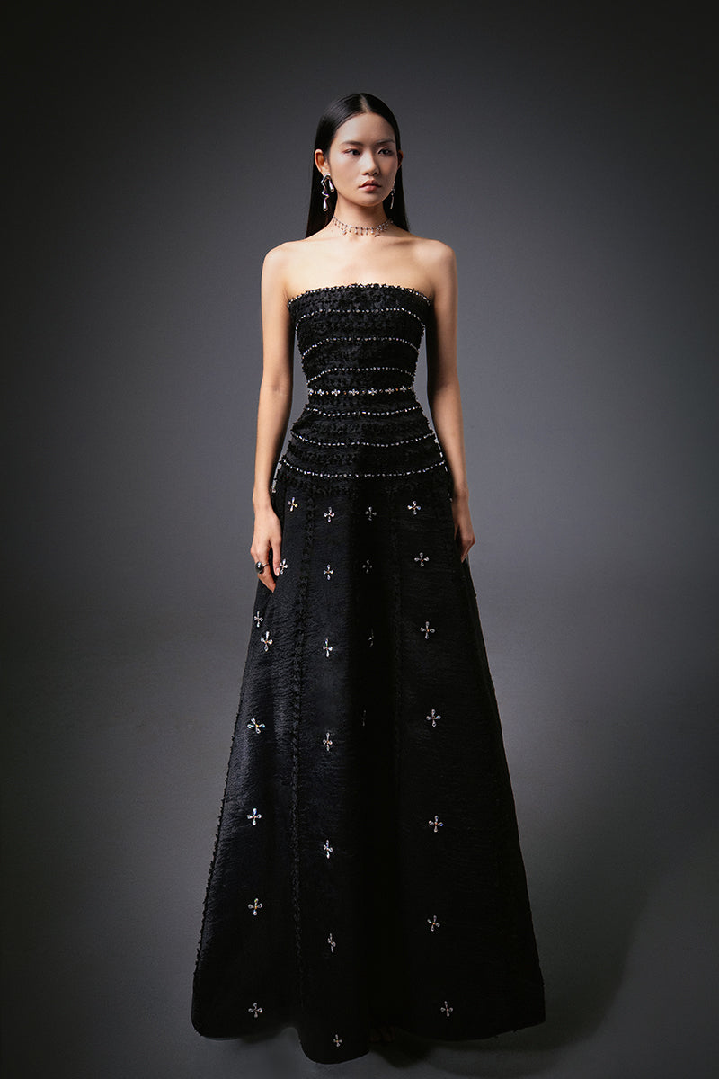 Black CULT MIA X HAPPY CLOTHING strapless gown made of stone organza with a flowy, elegant design.