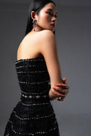 Black CULT MIA X HAPPY CLOTHING strapless gown with stone-organza fabric, featuring a flowing, elegant design for formal occasions.