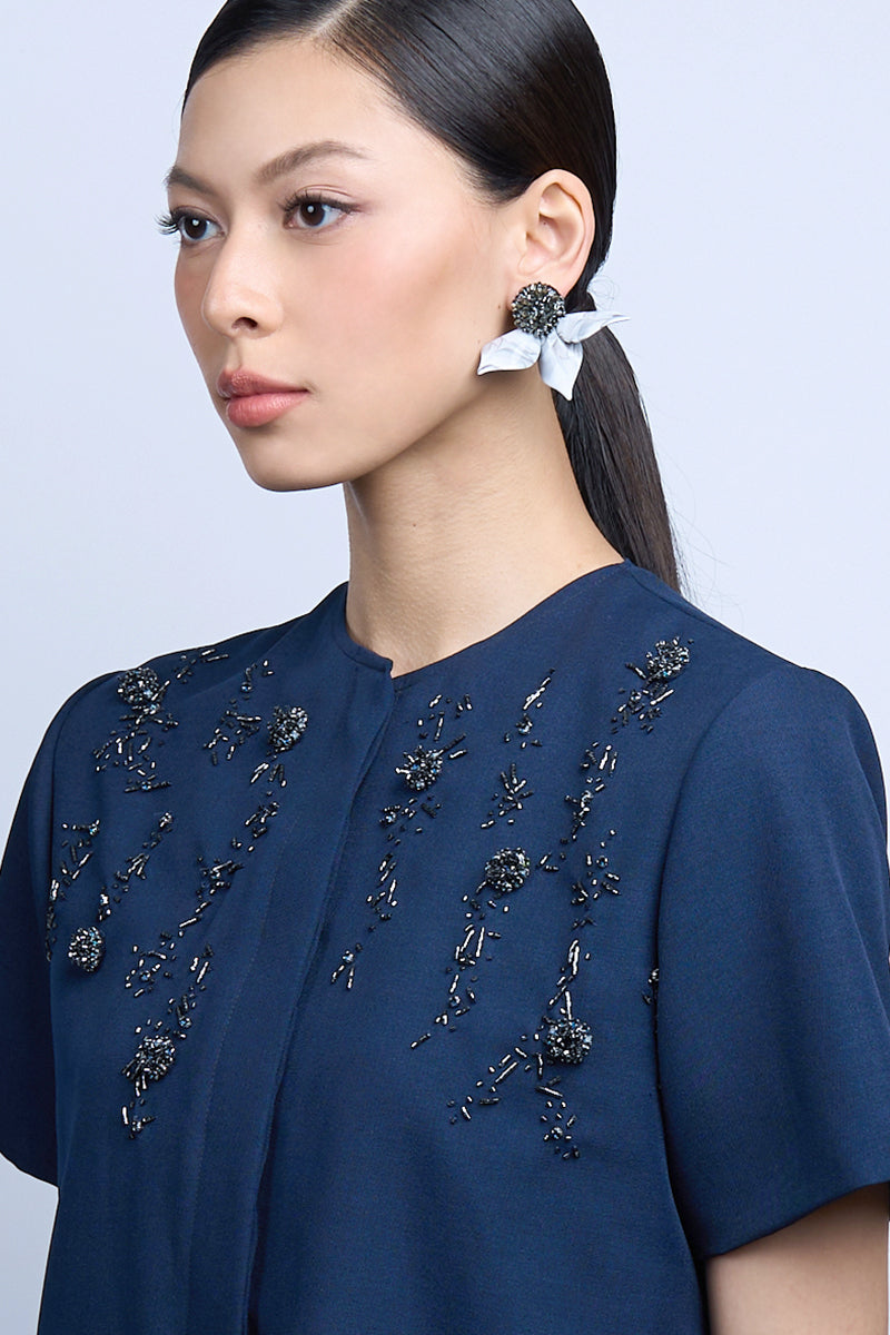 Gray earrings by Aidan & Ice featuring the DEW DOT design, shown in a close-up image highlighting their stylish, modern look.
