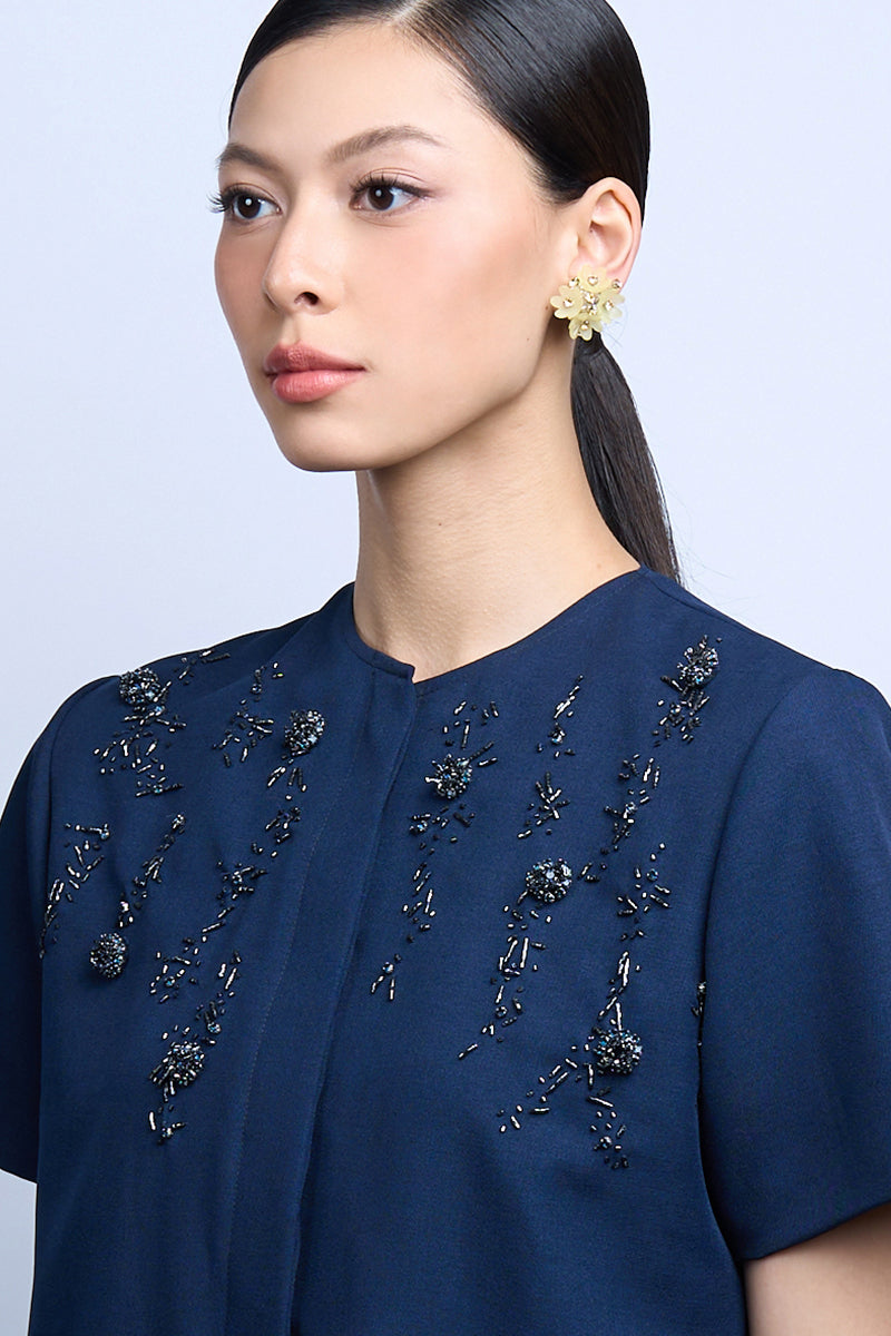 A pair of MELLOW LIME earrings by Aidan & Ice featuring vibrant lime-colored dangle earrings with gold accents.