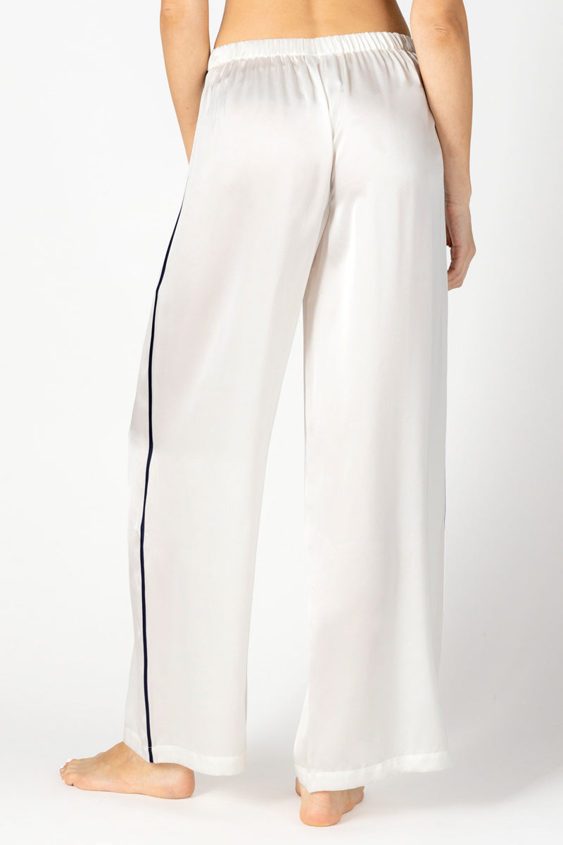 Back view of NK IMODE Marisa charming ivory silk lounge trousers showing relaxed fit and smooth fabric.