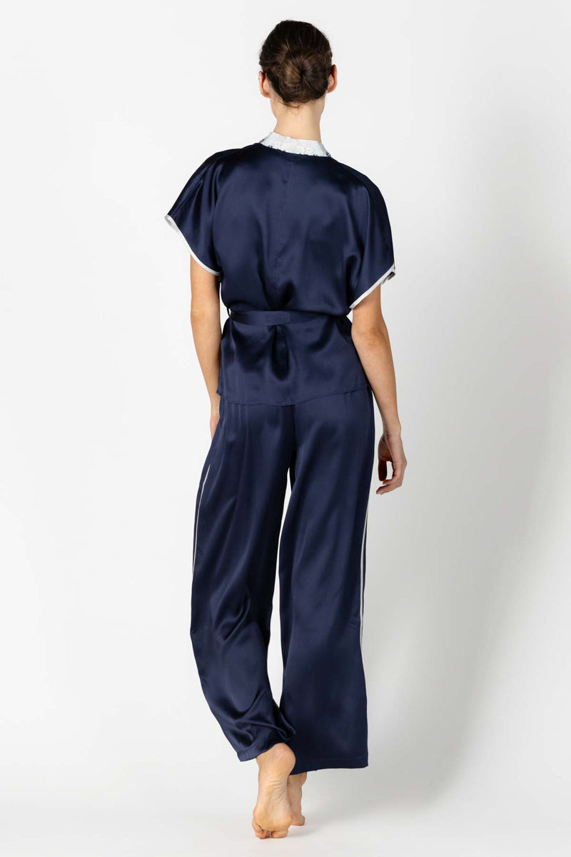 Back profile of NK IMODE Marisa charming silk kimono wrap jacket in elegant evening blue, showcasing its relaxed loungewear style.