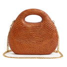 Emm Kuo Meadow Lane Rust top handle bag with structured silhouette and leather handle on a neutral background.
